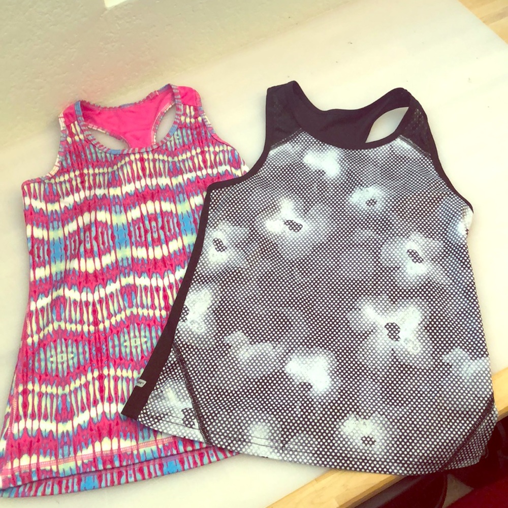 2 tank tops. One black, other pink